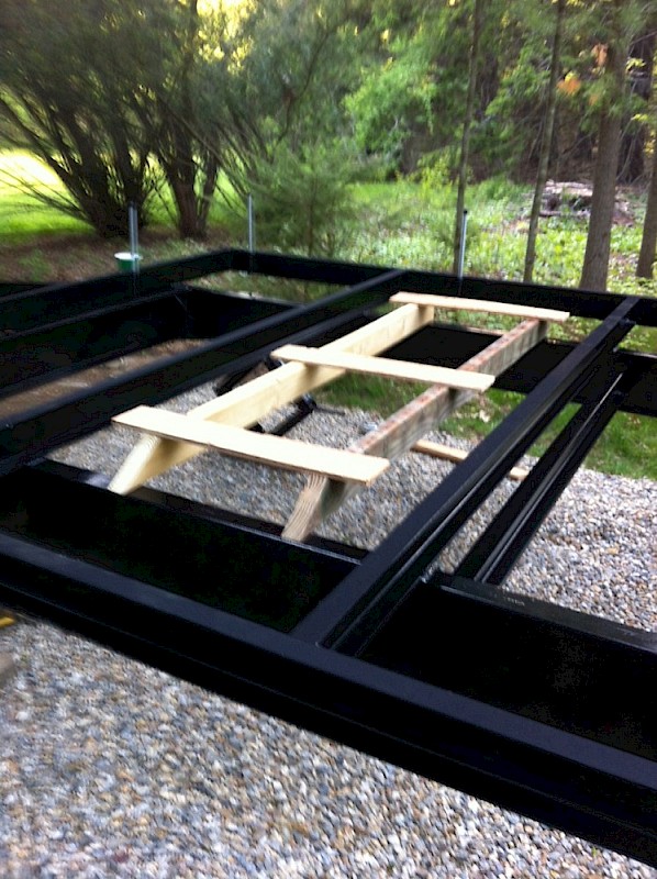 First support jig in place.  Ends of 2x4s are beveled to facilitate jig removal from underneath after Galvalume sheet and joists are secured in place.