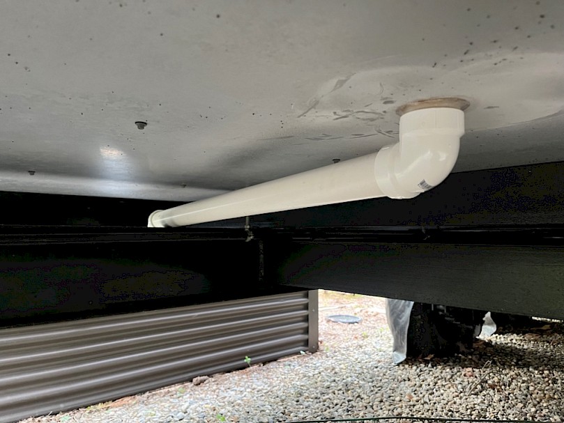 Greywater drain under tiny house