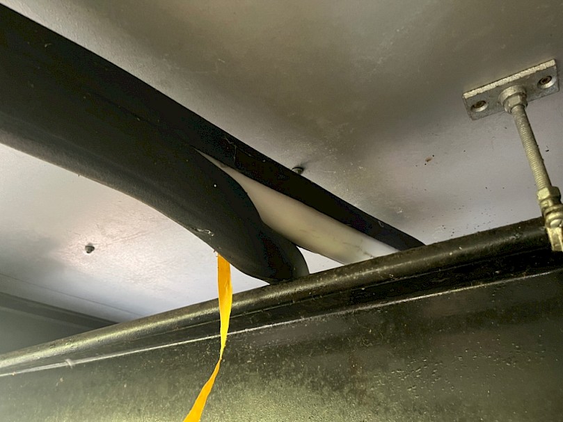 Installing insulation on the drain pipe under the house